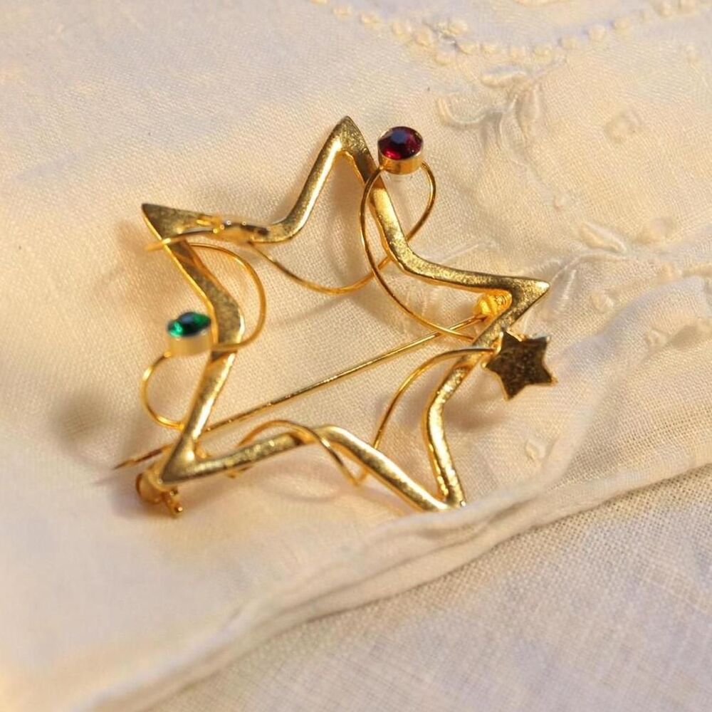 Vintage Gold-Tone Star Christmas Brooch with Red and Green Gems